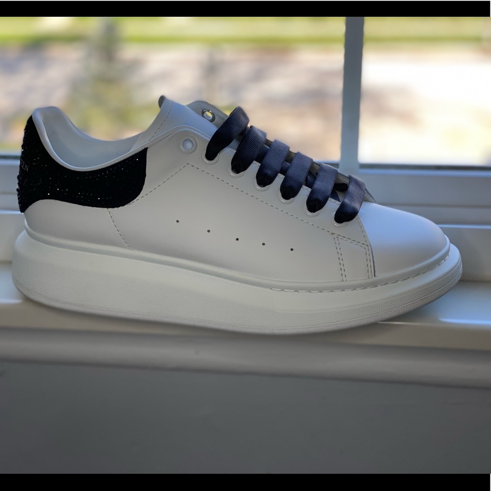ALEXANDER MCQUEEN White designer gym shoe.